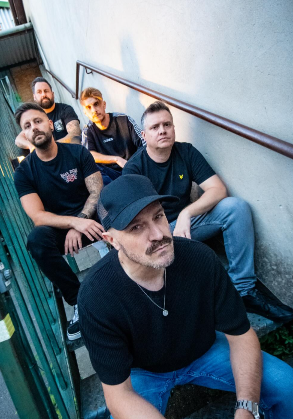Catalysts Wales press photo with the band sat on a staircase