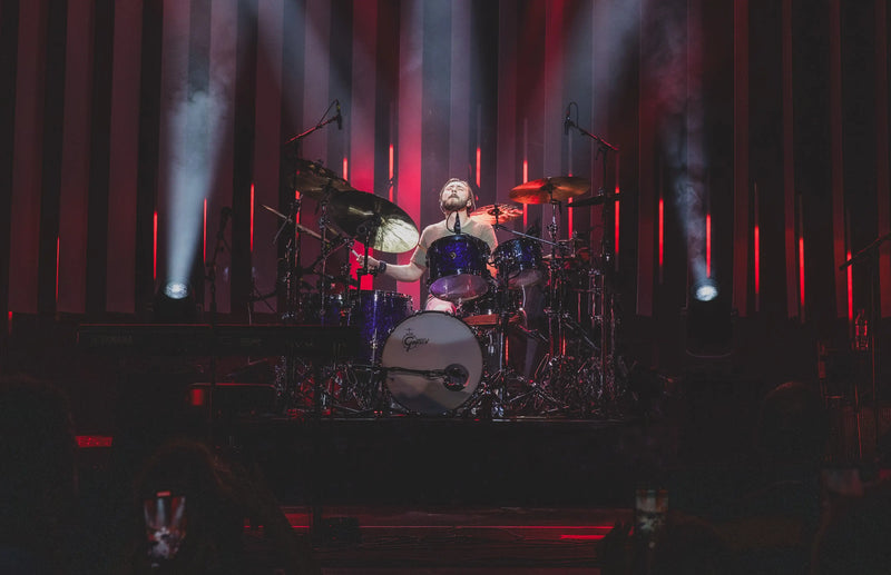 Above Average endorser Nic Collins playing drums on stage