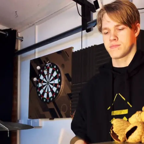 Drummer Charlie Gregory wearing his Above Average DRMMR hoodie