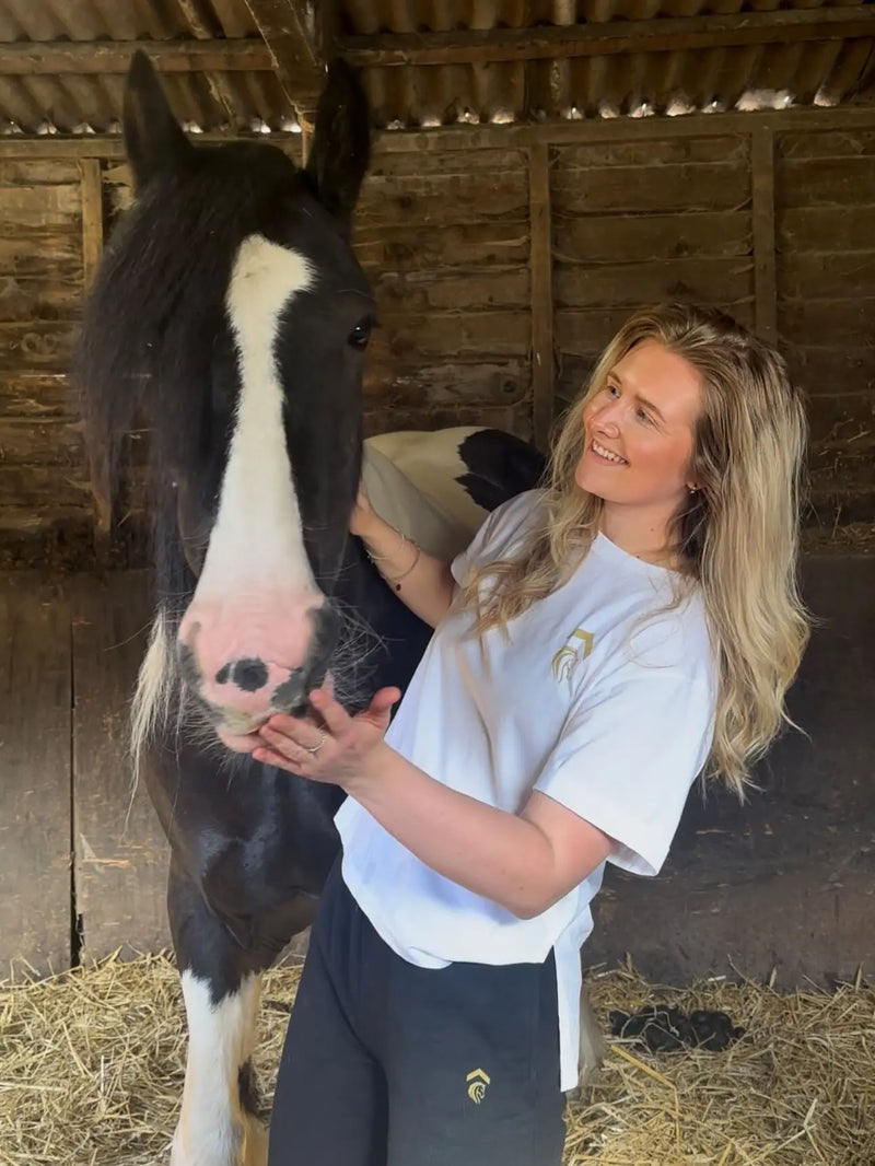 lily harvey wearing her white tee and black joggers from above average equestrian