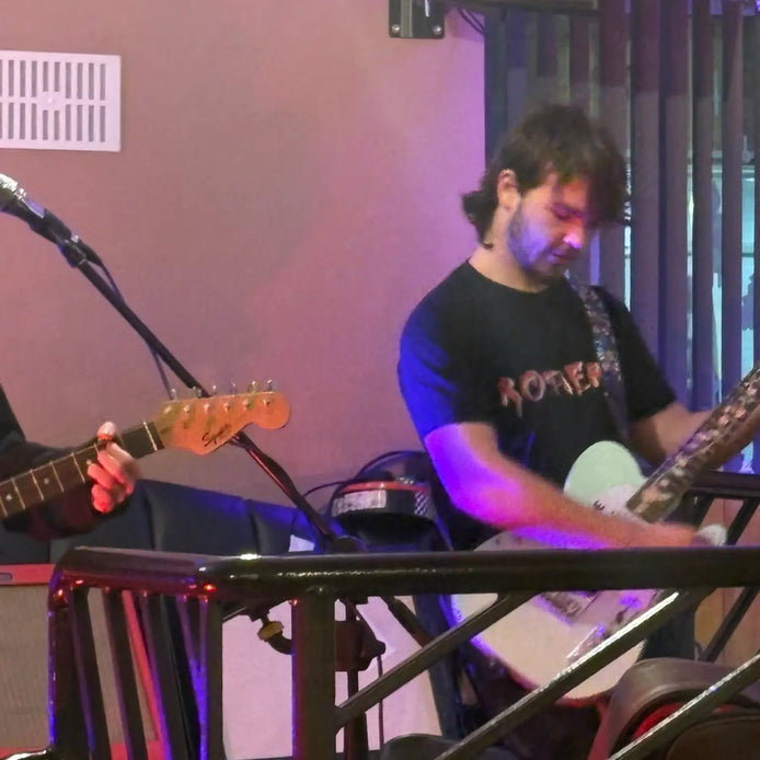 above average endorser jake rothera on stage with his band Serotine