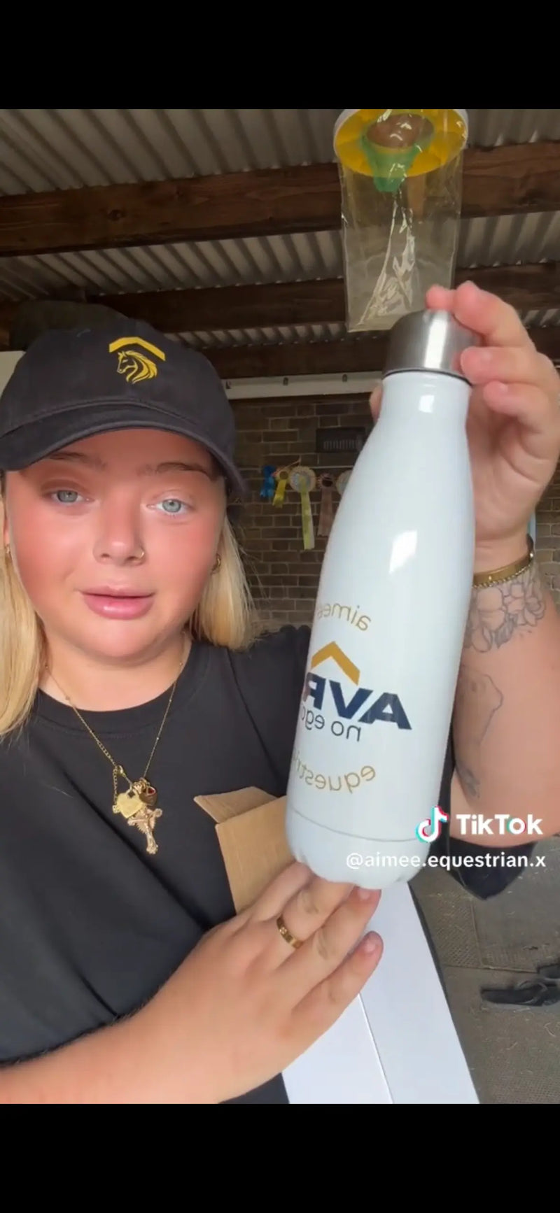 a picture of aimee from her TikTok video about Above Average Clothing