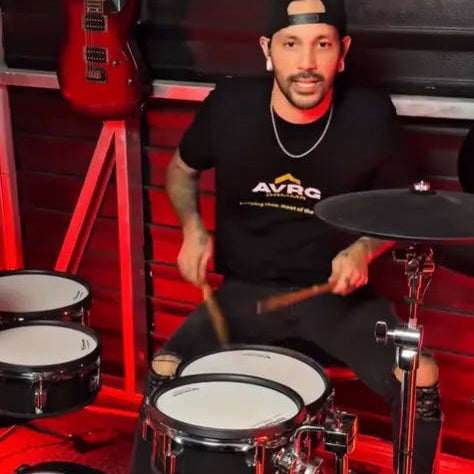 J Boye wearing his Above Average keeping time tee