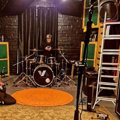 EchoBridge drummer Lloyd Crabb in the studio recording a track