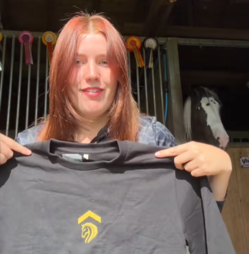 above average collaborator tamara greatrix showing her cropped eqstrn jumper on tiktok