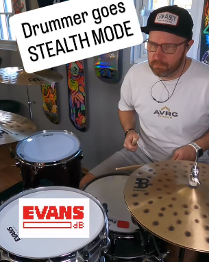 tom howarth playing drums wearing his above average clothing tee